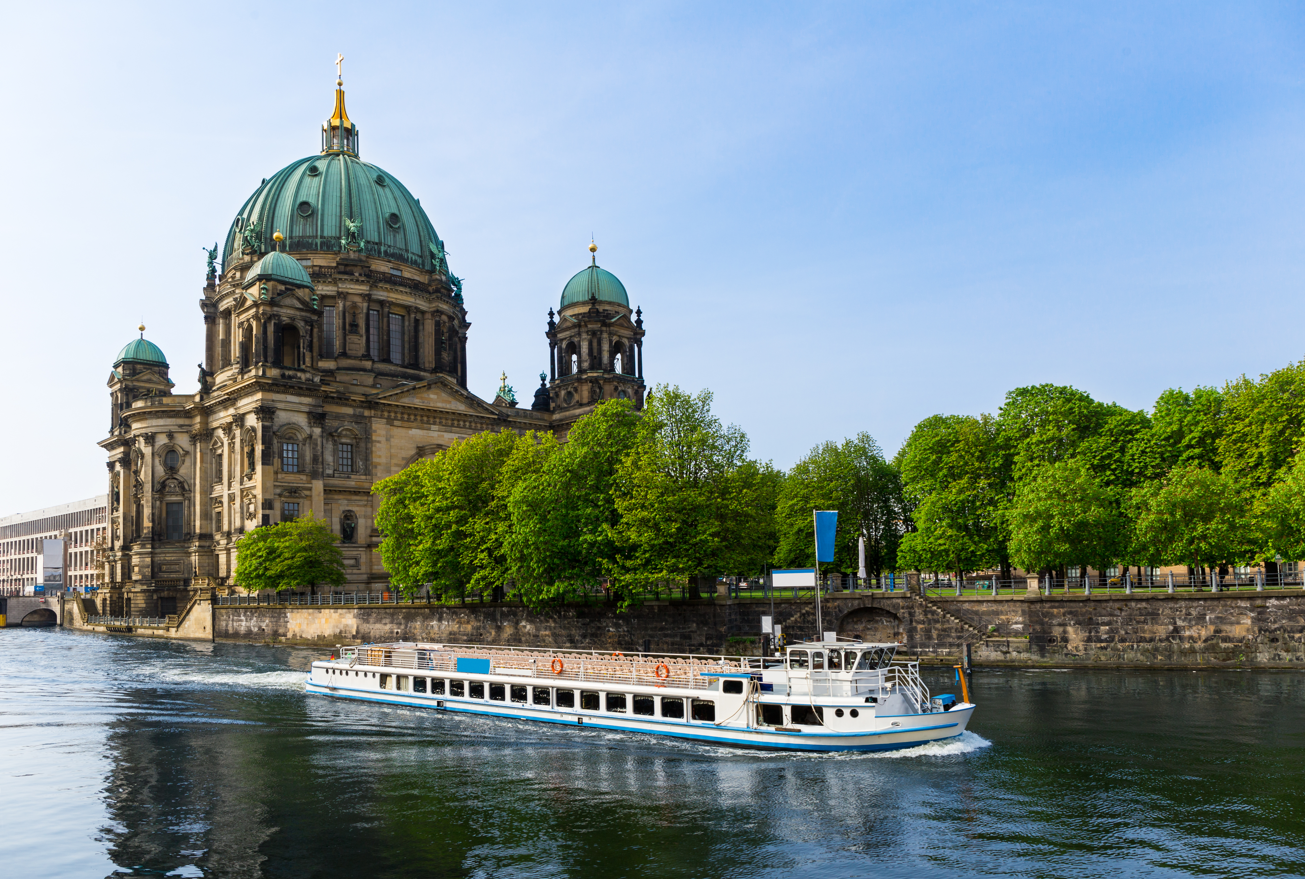 Berlin Cathedral, Germany with a boat in front view.